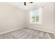 Bright bedroom with carpeted floors, neutral paint, a ceiling fan, and a window at 57 S Shreve Dr, Wendell, NC 27591