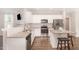 Updated kitchen showcasing granite countertops, stainless steel appliances, and white cabinets at 57 S Shreve Dr, Wendell, NC 27591