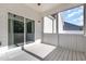 Relaxing screened-in porch featuring white-painted wood, an outdoor ceiling fan, and sliding glass door to the backyard at 57 S Shreve Dr, Wendell, NC 27591