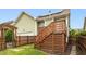 This outdoor space features a wooden deck with stairs and a privacy fence, ideal for entertaining at 59 Tobacco Farm Way, Chapel Hill, NC 27516