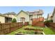 Landscaped backyard featuring garden beds and privacy fence at 59 Tobacco Farm Way, Chapel Hill, NC 27516
