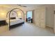 Cozy bedroom with a canopy bed, piano, and ample closet space at 59 Tobacco Farm Way, Chapel Hill, NC 27516