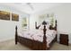 Bright bedroom with a four-poster bed, natural light, and neutral decor at 59 Tobacco Farm Way, Chapel Hill, NC 27516