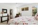 Bedroom showcasing a bed, natural light from windows, and access to an en-suite bathroom at 59 Tobacco Farm Way, Chapel Hill, NC 27516