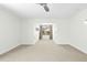 Spacious bonus room features neutral carpet, recessed lighting, and cozy window nook at 59 Tobacco Farm Way, Chapel Hill, NC 27516