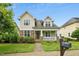 Charming home with a stone and shake exterior, a cozy front porch, and a well-manicured lawn at 59 Tobacco Farm Way, Chapel Hill, NC 27516