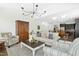 Spacious living room connecting to dining and kitchen areas, with comfortable seating and modern decor at 59 Tobacco Farm Way, Chapel Hill, NC 27516
