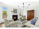 Inviting living room showcasing a fireplace, stylish decor, and views of the outdoors at 59 Tobacco Farm Way, Chapel Hill, NC 27516