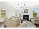 Cozy living room featuring a fireplace, comfortable seating, and natural light from the windows at 59 Tobacco Farm Way, Chapel Hill, NC 27516