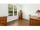 Cozy home office with hardwood floors, natural light, and classic wooden furniture at 59 Tobacco Farm Way, Chapel Hill, NC 27516