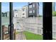 A fully fenced backyard with a small grass lawn, paving stones, and access to the main house at 606 Velma Hopkins Ln, Raleigh, NC 27603