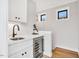 Wet bar with wine fridge, perfect for entertaining and relaxation at 606 Velma Hopkins Ln, Raleigh, NC 27603
