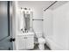 Well-lit bathroom featuring a shower-tub combo with white subway tile and a modern vanity at 606 Velma Hopkins Ln, Raleigh, NC 27603