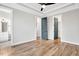 Spacious bedroom with hardwood floors, trey ceiling and multiple doorways at 606 Velma Hopkins Ln, Raleigh, NC 27603