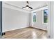 Cozy bedroom with hardwood flooring, large windows, and a modern ceiling fan at 606 Velma Hopkins Ln, Raleigh, NC 27603