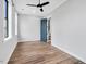 Spacious bedroom featuring hardwood floors, a ceiling fan, and a stylish, modern design with lots of natural light at 606 Velma Hopkins Ln, Raleigh, NC 27603