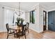 Cozy dining room with wood table set in front of large window at 606 Velma Hopkins Ln, Raleigh, NC 27603