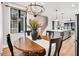 Bright dining area shows open floor plan leading to modern kitchen at 606 Velma Hopkins Ln, Raleigh, NC 27603