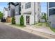 Modern home exterior with a fenced backyard, gated entrance, and landscaped yard at 606 Velma Hopkins Ln, Raleigh, NC 27603