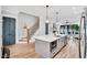 Open concept kitchen boasts a large island and seamlessly connects to the living area at 606 Velma Hopkins Ln, Raleigh, NC 27603