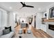 Bright living space connects the kitchen and living room, featuring modern finishes and open layout at 606 Velma Hopkins Ln, Raleigh, NC 27603