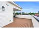 A spacious rooftop deck featuring wood-look decking and white siding offers a relaxing outdoor space with neighborhood views at 606 Velma Hopkins Ln, Raleigh, NC 27603