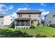 This backyard boasts a lush green lawn, a screened-in porch, and privacy fencing, perfect for outdoor living at 609 Redford Place Dr, Rolesville, NC 27571