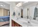 Bathroom features a double sink vanity and a large mirror for a functional and stylish space at 609 Redford Place Dr, Rolesville, NC 27571