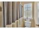 Bathroom with modern fixtures, a toilet, and a shower-tub combination provides convenience and functionality at 609 Redford Place Dr, Rolesville, NC 27571