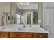 Bathroom with a wood vanity with a white countertop and framed mirror at 609 Redford Place Dr, Rolesville, NC 27571