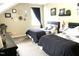 Stylishly designed bedroom featuring two inviting beds and decorative wall art creating a cozy retreat at 609 Redford Place Dr, Rolesville, NC 27571