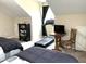 Bedroom features two beds, treadmill, TV, and small sitting area at 609 Redford Place Dr, Rolesville, NC 27571