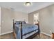 Bedroom with a queen-sized bed, neutral carpet, and a view into the ensuite bathroom at 609 Redford Place Dr, Rolesville, NC 27571