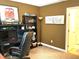 Well-organized bedroom featuring a workspace, bookcase, and inspirational decor, fostering productivity at 609 Redford Place Dr, Rolesville, NC 27571