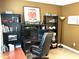 Functional bedroom with a workstation, bookcase, and a decorative train poster, offering ample storage at 609 Redford Place Dr, Rolesville, NC 27571