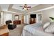 Large bedroom suite featuring a sitting area, walk in closet, and an ensuite bath at 609 Redford Place Dr, Rolesville, NC 27571