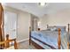 Bedroom with neutral walls and carpet, featuring a queen-size bed and adjoining bathroom at 609 Redford Place Dr, Rolesville, NC 27571