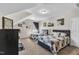 Bedroom featuring two beds with quilt bedding and decorative wall art at 609 Redford Place Dr, Rolesville, NC 27571