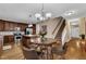 Hardwood floors in the dining area open to the kitchen and staircase at 609 Redford Place Dr, Rolesville, NC 27571
