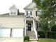 Charming two-story home featuring a welcoming front porch, two-car garage and well-maintained landscaping at 609 Redford Place Dr, Rolesville, NC 27571