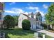 Well-maintained home with a two-car garage and lush landscaping on a sunny day, showcasing suburban charm and curb appeal at 609 Redford Place Dr, Rolesville, NC 27571