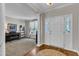 Warm and inviting foyer with a glimpse into a bright front room, offering a welcoming and spacious entry to the home at 609 Redford Place Dr, Rolesville, NC 27571