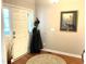 Foyer boasts a hardwood floor, a coat rack, and sidelight windows illuminating the front entryway at 609 Redford Place Dr, Rolesville, NC 27571