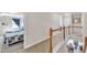 Second floor hallway featuring carpet and a view into the bedroom and dining room below at 609 Redford Place Dr, Rolesville, NC 27571