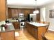 Well-equipped kitchen with stainless steel appliances, a center island, and plenty of cabinet space at 609 Redford Place Dr, Rolesville, NC 27571