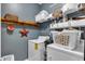 A well-organized laundry room offers storage and a functional space for laundry tasks at 609 Redford Place Dr, Rolesville, NC 27571