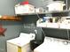 Functional laundry room with a washer, dryer, and shelving for organized storage solutions at 609 Redford Place Dr, Rolesville, NC 27571