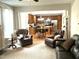 Open-concept view of the living room and kitchen, showcasing comfortable seating and an inviting atmosphere at 609 Redford Place Dr, Rolesville, NC 27571
