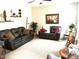 This spacious living room has plush seating and neutral-toned walls at 609 Redford Place Dr, Rolesville, NC 27571