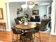 Inviting living room area with hardwood floors, comfortable seating, decorative plants, and stylish lighting at 609 Redford Place Dr, Rolesville, NC 27571